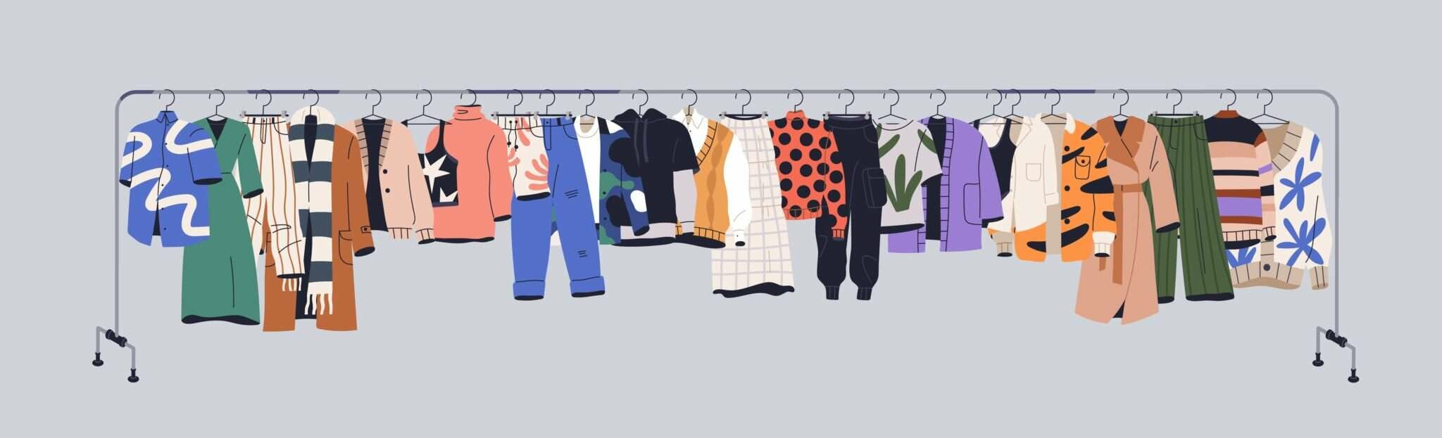 スペインの灰色の背景に洋服のラックが掛かっています。